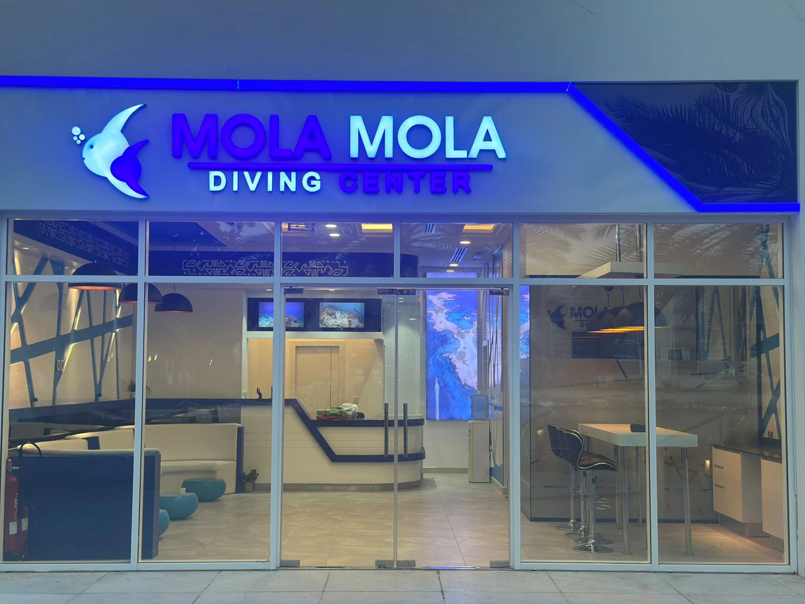 MolaMola Diving Center lit up at night