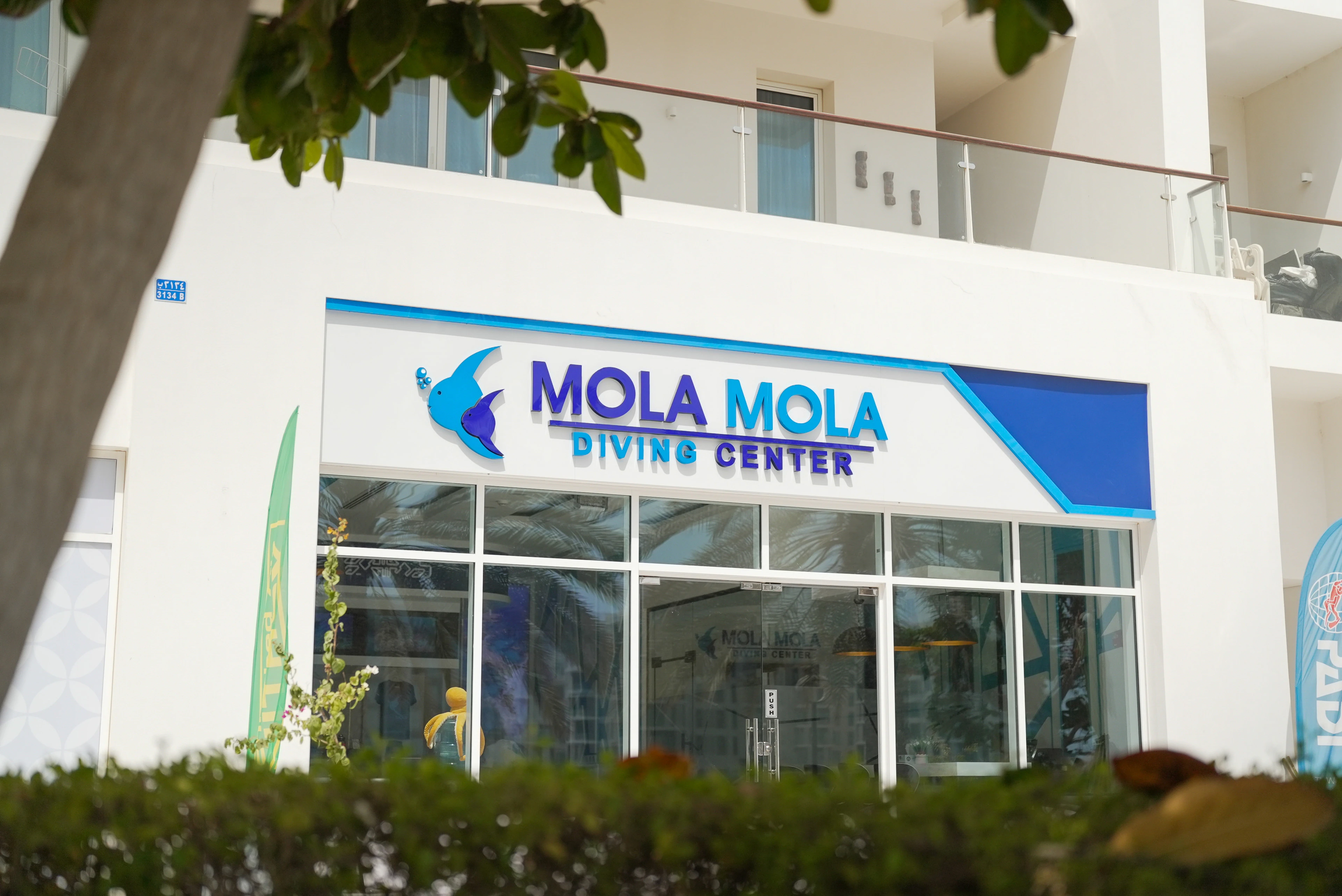 MolaMola Diving Center sign at Al Mouj